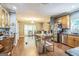 Spacious kitchen with stainless steel appliances, wood floors, and plenty of room for dining and entertaining at 871 Rocky Creek Rd, Hampton, GA 30228