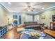 Casual living room with hardwood floors, an area rug, and a cozy seating area at 871 Rocky Creek Rd, Hampton, GA 30228