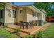 Cozy back deck with outdoor dining set, surrounded by well-maintained landscaping, perfect for entertaining at 3170 Butler Se Ave, Covington, GA 30014