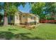 Charming back yard featuring a wooden deck with outdoor seating and a lush lawn, ideal for relaxation at 3170 Butler Se Ave, Covington, GA 30014