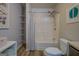Clean bathroom features a white shower-tub, open shelving, and neutral wall paint at 3170 Butler Se Ave, Covington, GA 30014