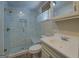 Bathroom featuring a walk-in glass shower with marble-style tiling and a built-in seat at 3170 Butler Se Ave, Covington, GA 30014