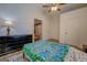 Bright bedroom with wood flooring, a ceiling fan and white walls at 3170 Butler Se Ave, Covington, GA 30014