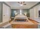Bright bedroom with wood floors, large bed, bedside tables, and white trim at 3170 Butler Se Ave, Covington, GA 30014