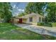 Exterior view of a one-story home with a convenient carport, offering covered parking and easy access to the property at 3170 Butler Se Ave, Covington, GA 30014