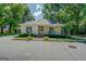 Inviting single-story home boasts a covered porch, and manicured landscaping enhancing its curb appeal at 3170 Butler Se Ave, Covington, GA 30014