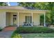 Cozy front porch with seating area offers a relaxing outdoor space and enhances the home's curb appeal at 3170 Butler Se Ave, Covington, GA 30014