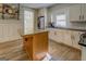An open, bright kitchen offers stainless appliances, granite counters and island at 3170 Butler Se Ave, Covington, GA 30014