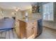The well-lit kitchen features an island, stainless appliances, and open shelving at 3170 Butler Se Ave, Covington, GA 30014