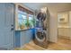 Convenient laundry area with stacked washer and dryer set at 3170 Butler Se Ave, Covington, GA 30014