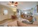 Open living room with wood floors, ceiling fan and views to the kitchen at 3170 Butler Se Ave, Covington, GA 30014