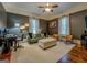 Relaxing living room with textured walls, stylish seating, and a ceiling fan for comfort at 3170 Butler Se Ave, Covington, GA 30014