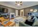 Comfortable living room with fireplace, media center, stylish seating and soft, bright rug at 3170 Butler Se Ave, Covington, GA 30014