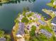 Stunning aerial view of lakefront condos nestled among lush greenery and sparkling water, offering serene waterfront living at 705 Berry Ct, Villa Rica, GA 30180