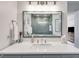 Bathroom with framed mirror and a glass-enclosed shower at 705 Berry Ct, Villa Rica, GA 30180