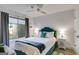 Cozy bedroom with stylish decor, including a comfortable bed, a window, and decorative side tables with lamps at 705 Berry Ct, Villa Rica, GA 30180