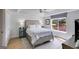 Bedroom featuring a tray ceiling and large window view at 705 Berry Ct, Villa Rica, GA 30180