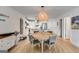 Cozy dining area adjacent to the kitchen, featuring a round table, stylish chairs, and seamless access to other living spaces at 705 Berry Ct, Villa Rica, GA 30180