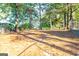 Large backyard features trees and open space behind the house at 8500 Bowen Ct, Jonesboro, GA 30238