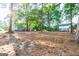 Large backyard featuring trees and open space behind the house at 8500 Bowen Ct, Jonesboro, GA 30238