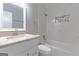 Beautiful bathroom with granite vanity, shower/tub with new tiling, and modern fixtures at 8500 Bowen Ct, Jonesboro, GA 30238
