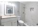 Beautiful bathroom with granite vanity, shower/tub with new tiling, and modern fixtures at 8500 Bowen Ct, Jonesboro, GA 30238
