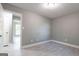 Charming bedroom features gray walls and light wood look floors with a window view to outdoors at 8500 Bowen Ct, Jonesboro, GA 30238