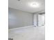 The modern bedroom features gray walls, white trim and gleaming marble floors at 8500 Bowen Ct, Jonesboro, GA 30238