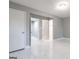 Spacious bedroom featuring modern gray walls and gleaming marble floors at 8500 Bowen Ct, Jonesboro, GA 30238