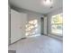 Bedroom features modern gray walls and light wood look floors with a window for natural light at 8500 Bowen Ct, Jonesboro, GA 30238