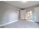 Bedroom featuring white door, light-colored floors, and neutral gray walls at 8500 Bowen Ct, Jonesboro, GA 30238