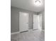 Modern bedroom features gray walls, light wood look floors, and lots of closet space at 8500 Bowen Ct, Jonesboro, GA 30238