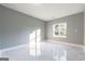 Spacious bedroom with large window offering natural light and tiled floor at 8500 Bowen Ct, Jonesboro, GA 30238