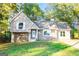 Charming home featuring stone and vinyl siding, complemented by a well-maintained lawn and mature trees at 8500 Bowen Ct, Jonesboro, GA 30238