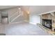 Stunning view of new light floors, fresh paint, stone fireplace, chandelier, and staircase at 8500 Bowen Ct, Jonesboro, GA 30238
