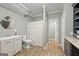 Neutral bathroom features a shower/tub combo, vanity, gray walls, wood look flooring, and white trim at 1130 S Rudder Rd, Cumming, GA 30041
