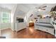 Bright bedroom with hardwood floors, fan, and lots of natural light from the window at 1130 S Rudder Rd, Cumming, GA 30041