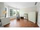 Bright and airy bedroom with large windows, hardwood floors, and neutral décor at 1130 S Rudder Rd, Cumming, GA 30041