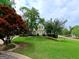 Charming home surrounded by vibrant landscaping and a lush green lawn, set back from the street for added privacy at 1130 S Rudder Rd, Cumming, GA 30041