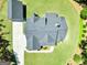 Overhead shot of a house with well-maintained lawn and long paved driveway at 120 Laurel Forest Dr, Tyrone, GA 30290