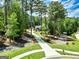 Picturesque aerial of home situated among mature trees and featuring a long driveway at 120 Laurel Forest Dr, Tyrone, GA 30290