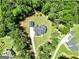 Aerial shot of a property showcasing mature trees and a private, detached garage at 120 Laurel Forest Dr, Tyrone, GA 30290
