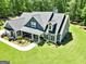 An elevated view showcases the meticulously landscaped front yard and charming home at 120 Laurel Forest Dr, Tyrone, GA 30290