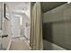 A fully renovated bathroom with neutral colors and a gray subway tiled shower at 120 Laurel Forest Dr, Tyrone, GA 30290