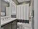 Cozy bathroom features a tub with shower, vanity with sink, and a window for natural light and ventilation at 120 Laurel Forest Dr, Tyrone, GA 30290