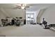 Spacious bonus room featuring a ceiling fan and versatile layout, perfect for hobbies and relaxation at 120 Laurel Forest Dr, Tyrone, GA 30290