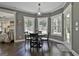 Cozy breakfast nook with natural light, hardwood floors, and a round table at 120 Laurel Forest Dr, Tyrone, GA 30290