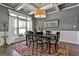 This dining room features a coffered ceiling, a window with natural light, and a wooden table at 120 Laurel Forest Dr, Tyrone, GA 30290