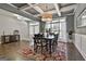 Sophisticated dining area featuring coffered ceilings, ample natural light, and hardwood flooring at 120 Laurel Forest Dr, Tyrone, GA 30290
