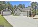 Long driveway leading to a large detached garage on this wooded property at 120 Laurel Forest Dr, Tyrone, GA 30290
